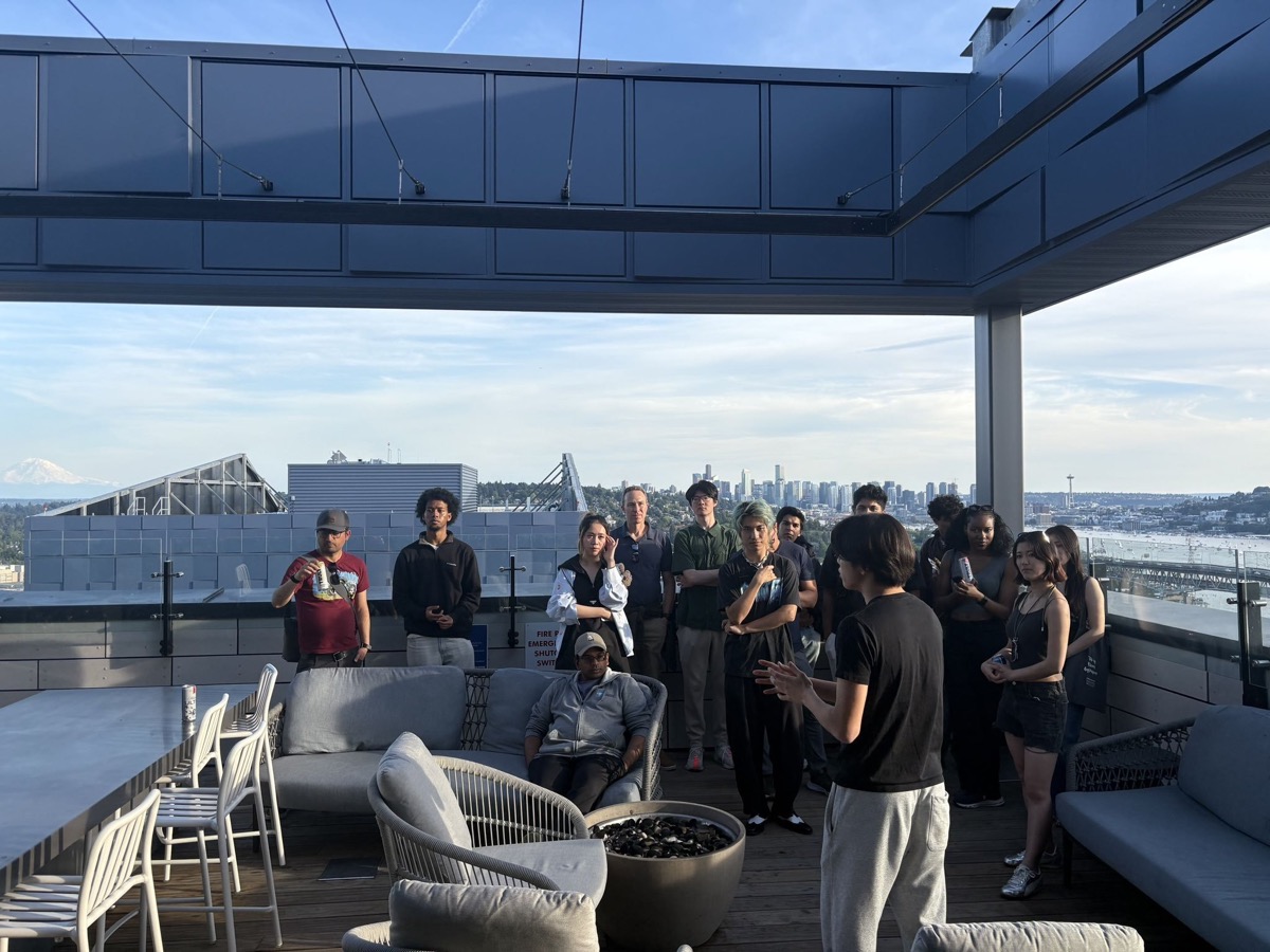 UW Blockchain Society members and Seattle Web3 founders on a rooftop overlooking the downtown skyline at MetaMask Dev Builders Night